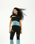 Denim and rib corset top with a twisted shoulder cut out