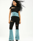 Stretch black and denim pants with cut outs