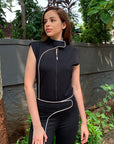 Black zippered top with white piping detailing