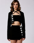 Crop jacket, a mini skirt and a crop with floral detailing