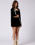 Crop jacket, a mini skirt and a crop with floral detailing