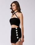 Black skirt with floral details